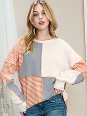 Sudadera de punto con cuello redondo y costuras expuestas en bloques de color